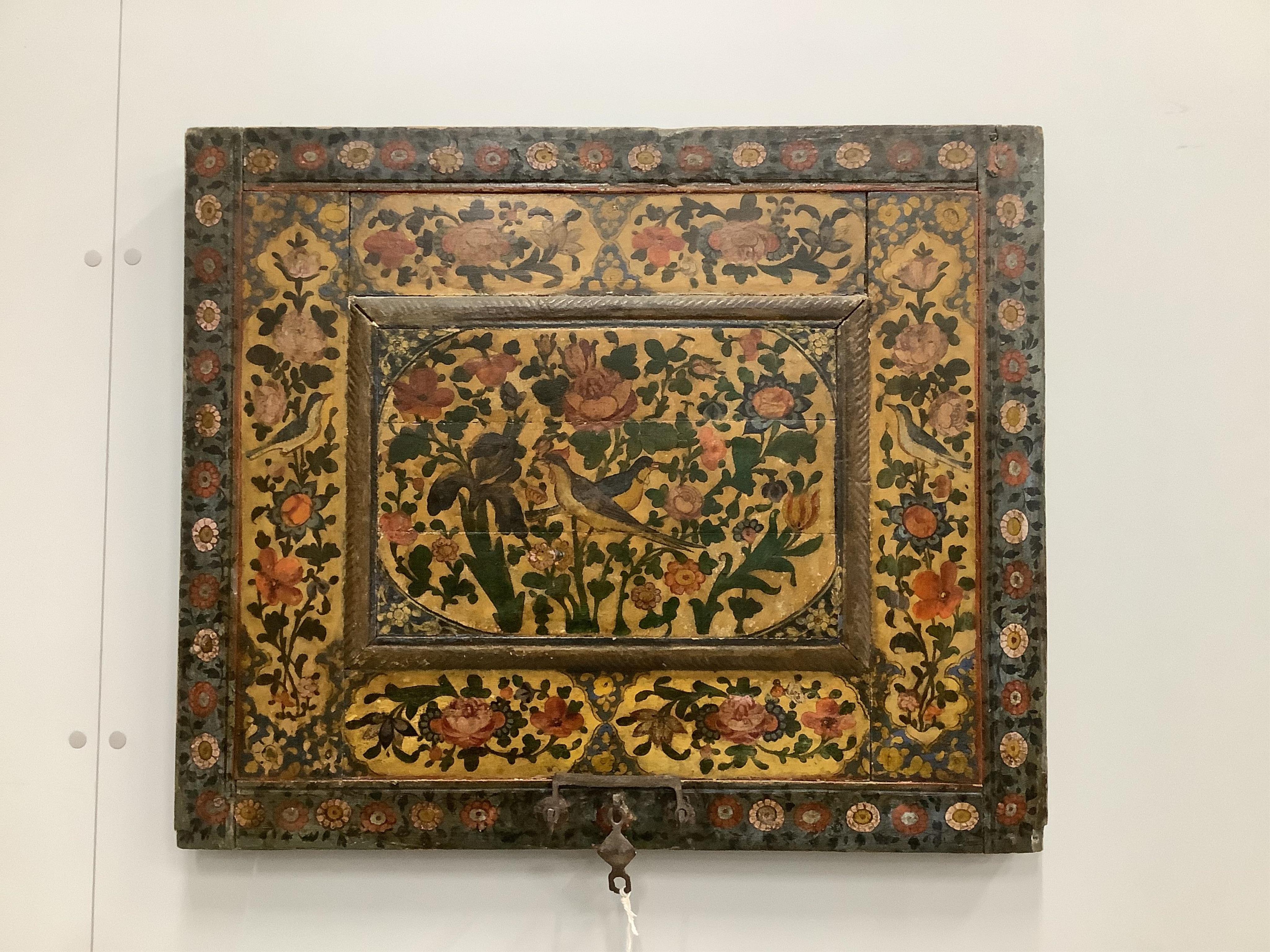 A 19th century Indian painted wooden box cover, now as a decorative wall panel, width 74cm, height 62cm. Condition - fair